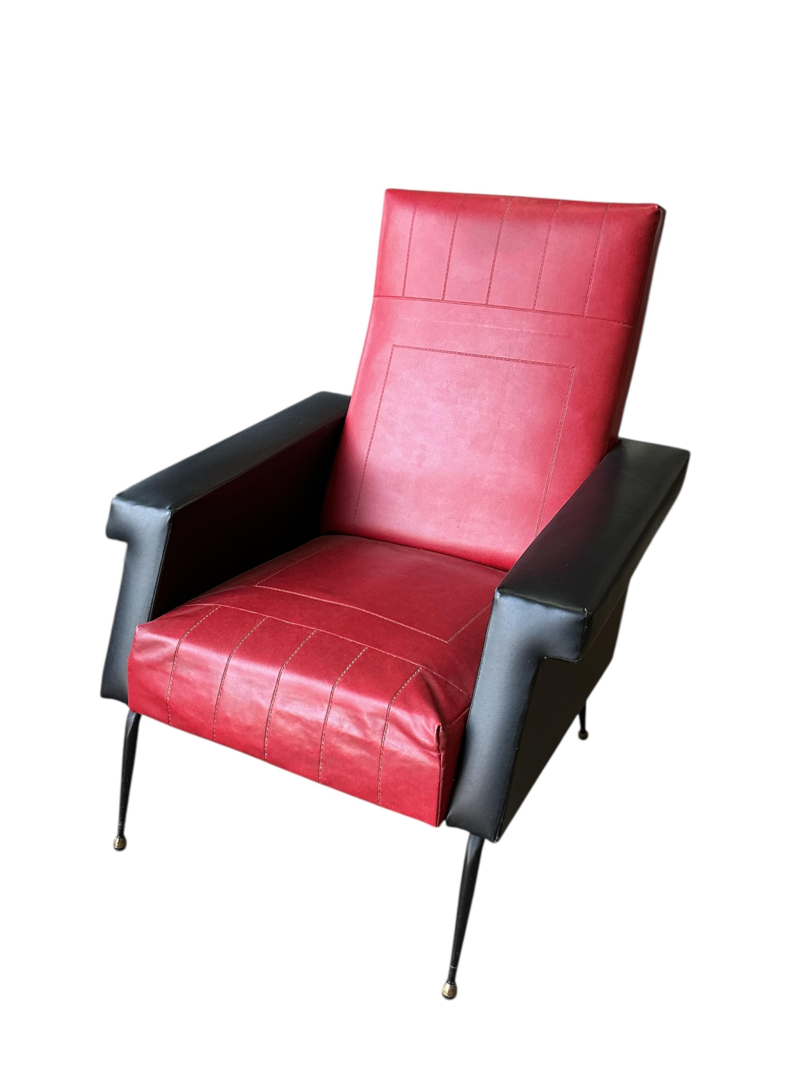 A pair of 1970's leatherette armchairs, width 74cm, depth 78cm, height 93cm